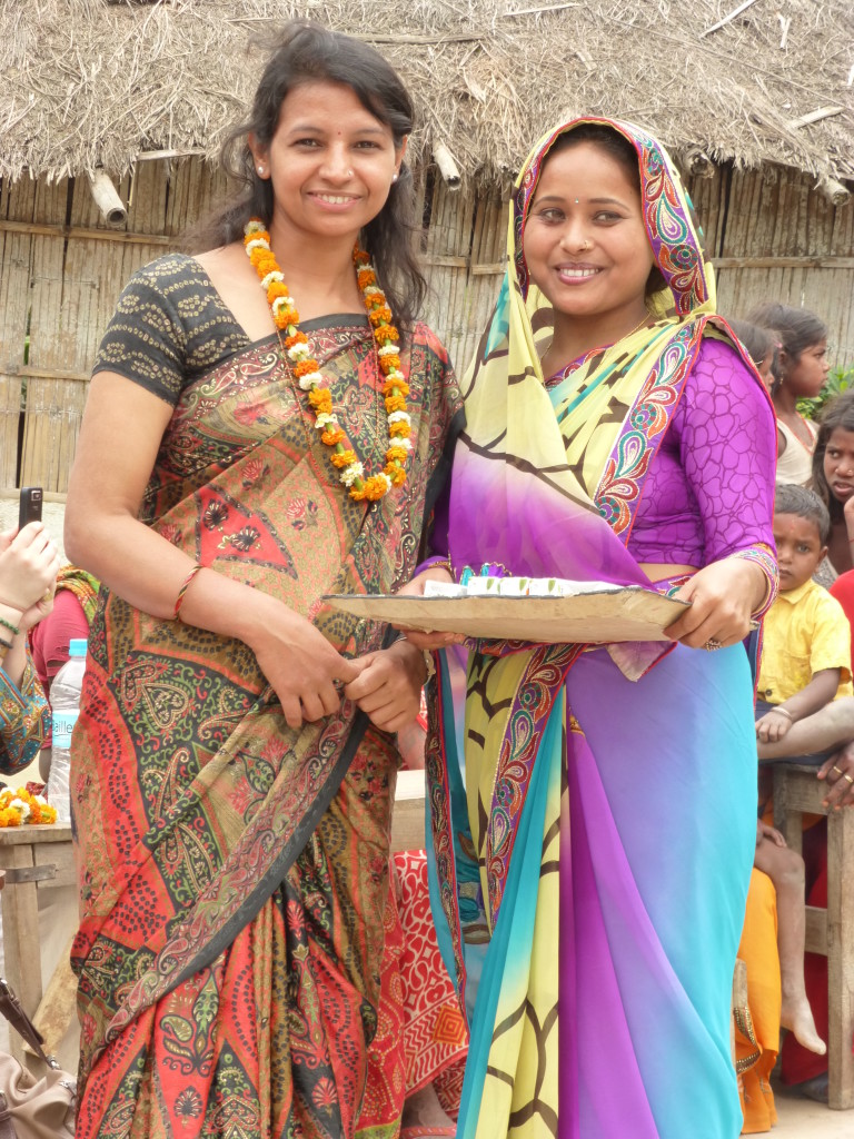 Meena with a participant in a peacebuilding program. 